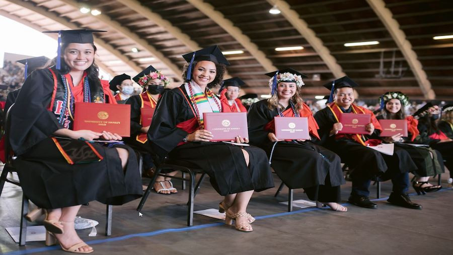 Class of 2022 DKICP graduates seated at EK stadium.