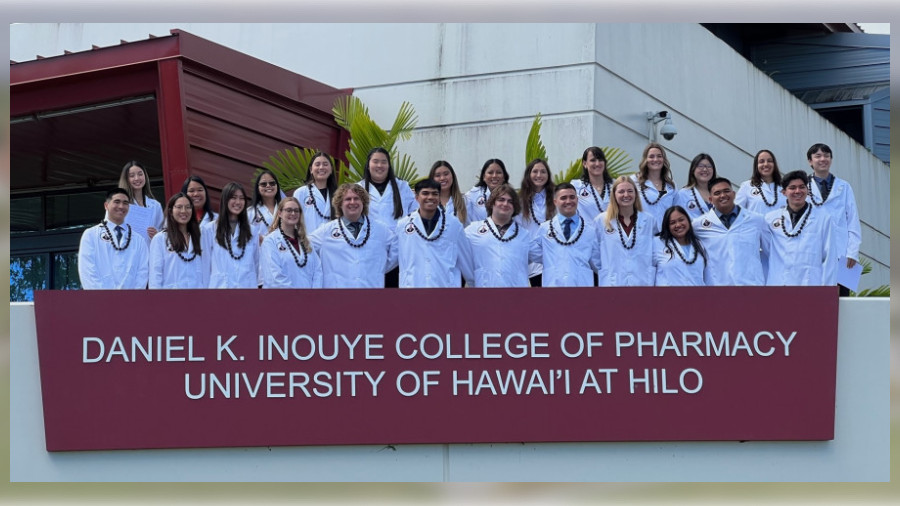 Members of the Class of 2027 pose after officially donning their white coats.