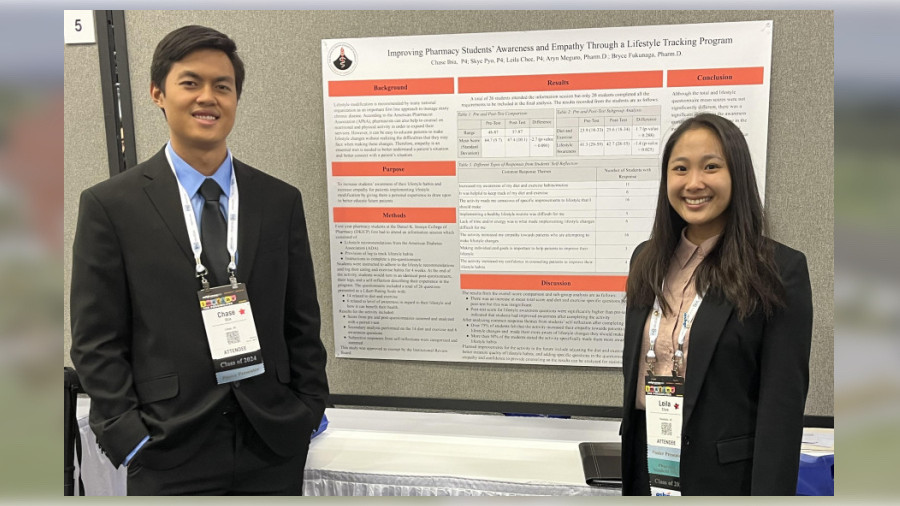 Student pharmacists Chase Ibia and Leila Chee pose by the poster presenting their research at the national ASHP Midyear Meeting.