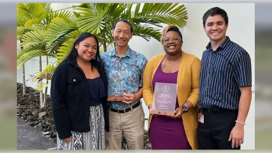 Class of 2027 students Kiʻana Benavente (left) and Kamahao Kini-Lopes (right) congratulate Drs. Dianqing Sun and Faith Hicks for being chosen to receive the Excellence in Teaching award.