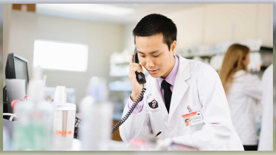 A DKICP student pharmacist practices providing phone-based medication therapy management services to patients.